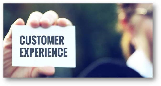 Person holding card that says 'customer experience'