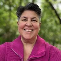 Anna Cargill of Atomic8Ball, smiling in a pink jacket outdoors, co-presenting the Is Google Dead webinar on AI search