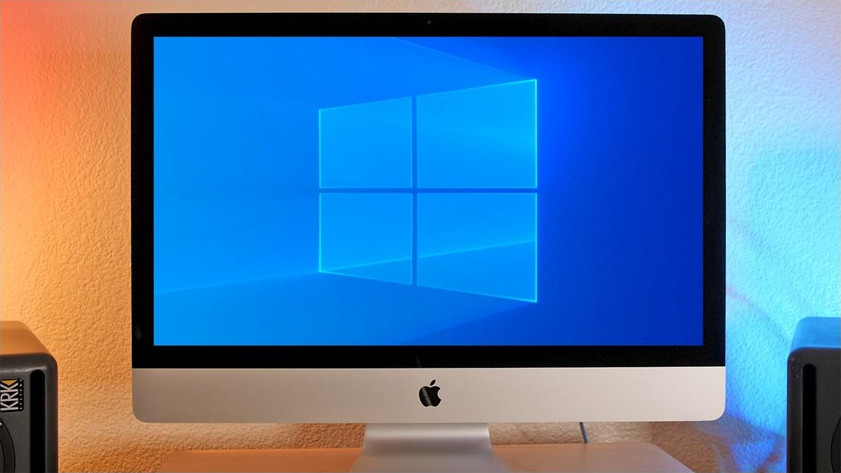 Apple desktop compter with RGB background.