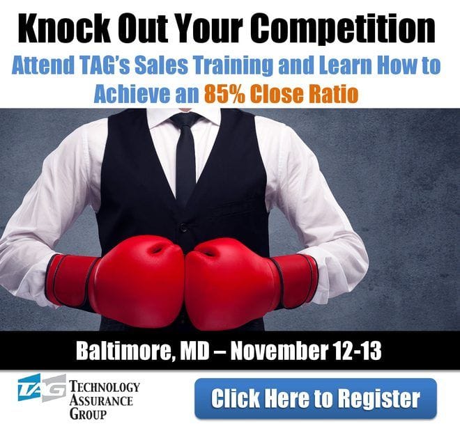 Presenter in a vest holding red boxing gloves under text about knocking out the competition at TAG's Baltimore sales training