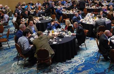 People Seated at Round Table for Dinner at a Convention