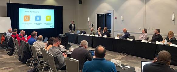 A group of people paying attention to a presentation at a TAG workshop