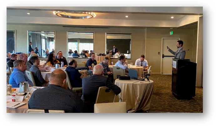 A group of people paying attention to a presentation at a TAG workshop