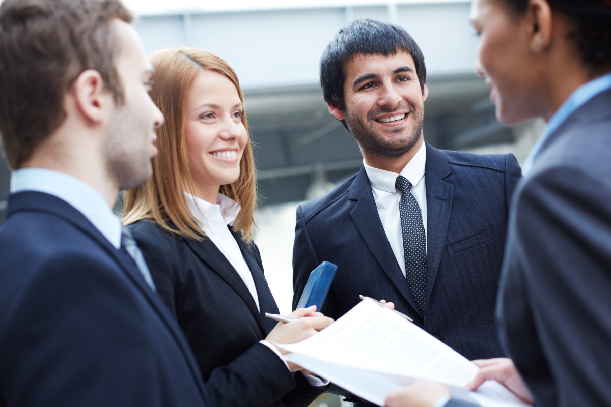 A group of business people chatting