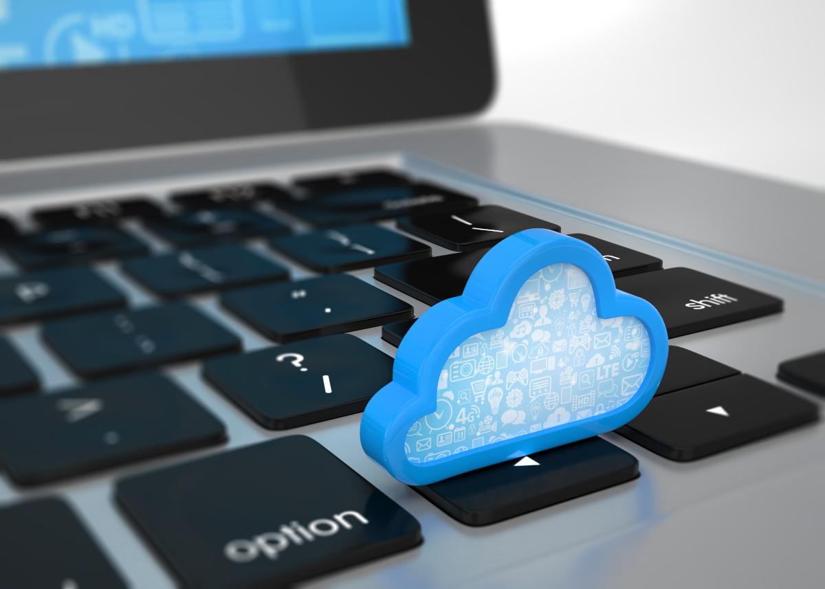 A blue cloud sitting on a laptop keyboard