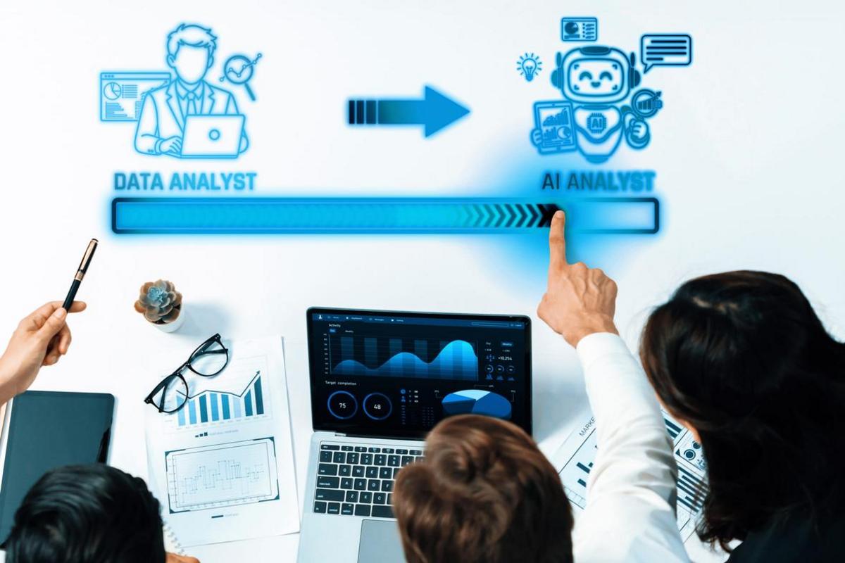 Team reviewing analytics as a data analyst role shifts to an AI analyst.