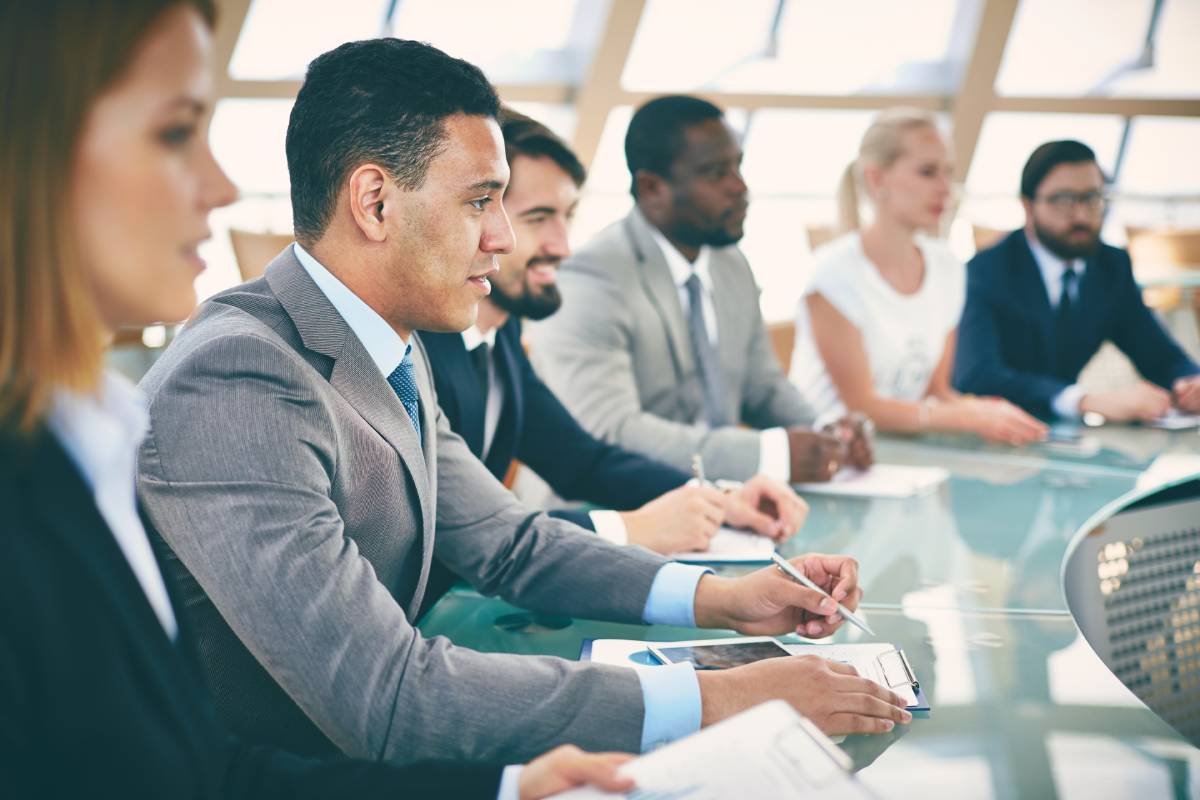 Business people watching a presentation in a conference room