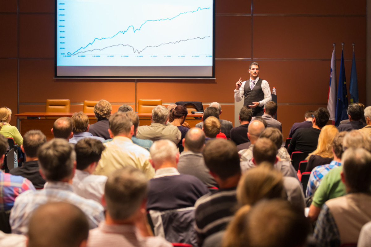 A businessman presenting to a group of people