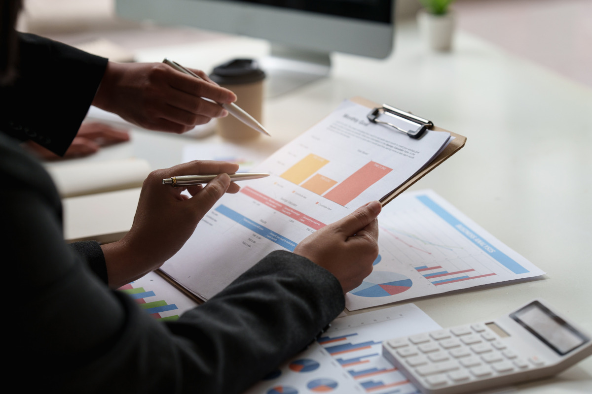 Two men looking at documents